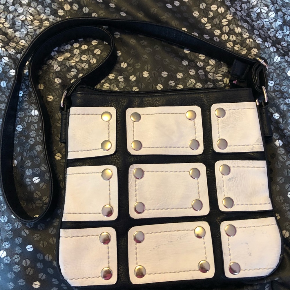 White, Black, and Gold studded handbag.